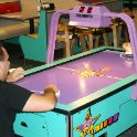 Nicholas plays air hockey with Daddy